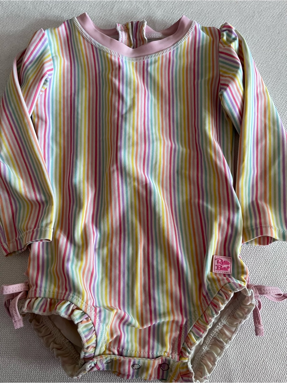 Ruffle Butts Pastel Rainbow Stripe one piece swimsuit with Pink Trim